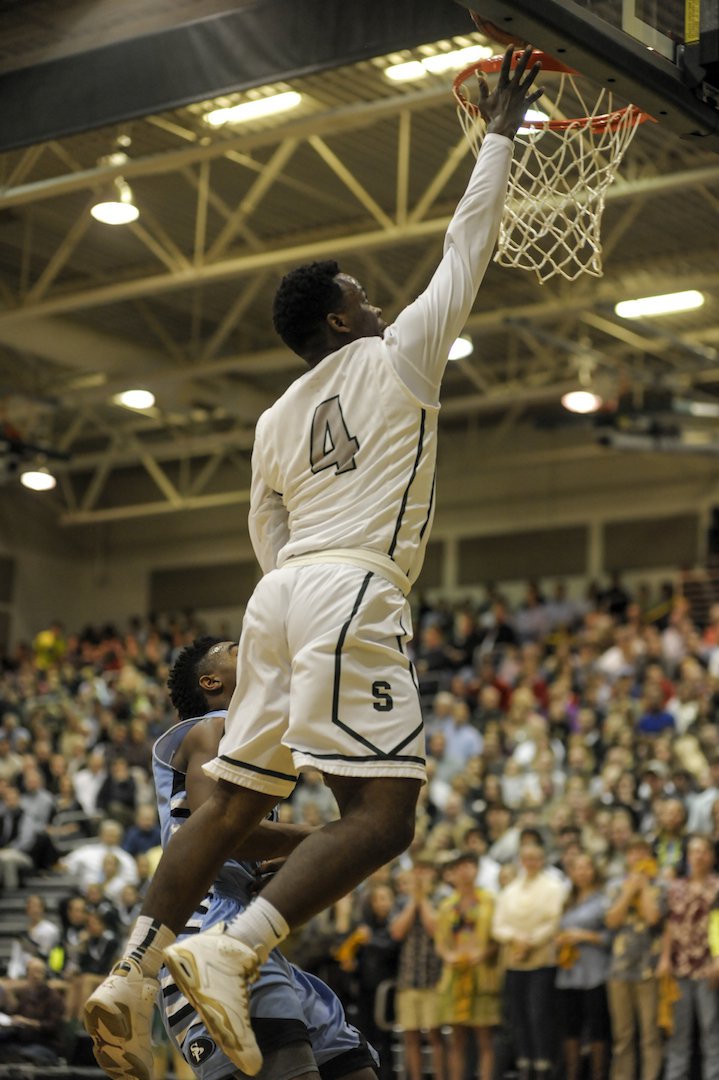 Terrell Guy drives for a Mountain Brook layup.