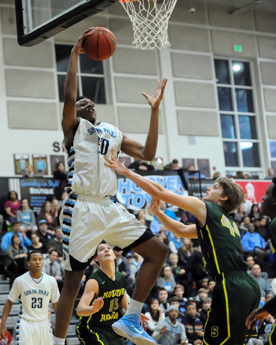 Austin Wiley drives to the hoop for Spain Park against Mountain Brook.